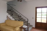 Hall - stairs to upstairs and door outside